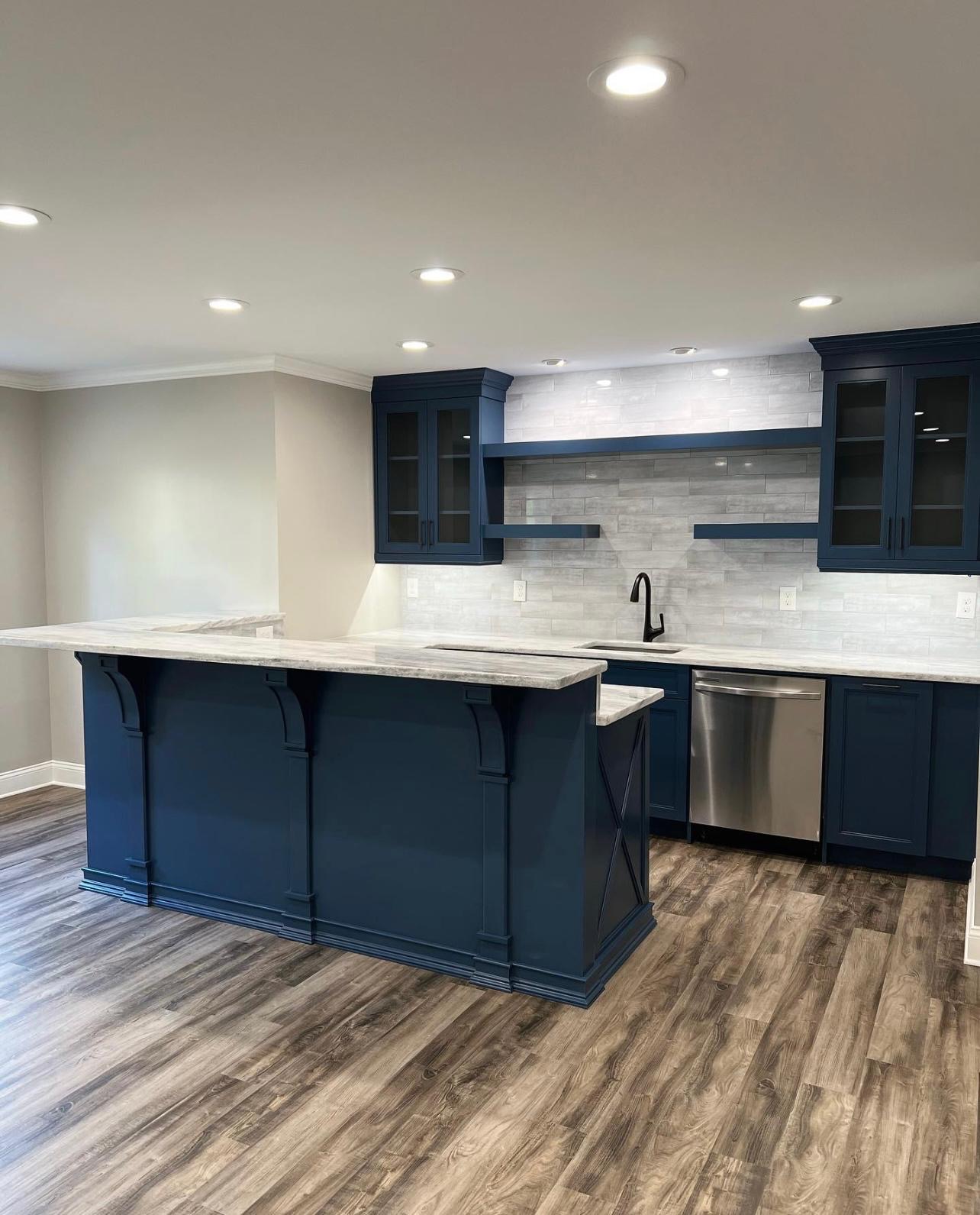 Navy blue kitchen remodel with LVP flooring