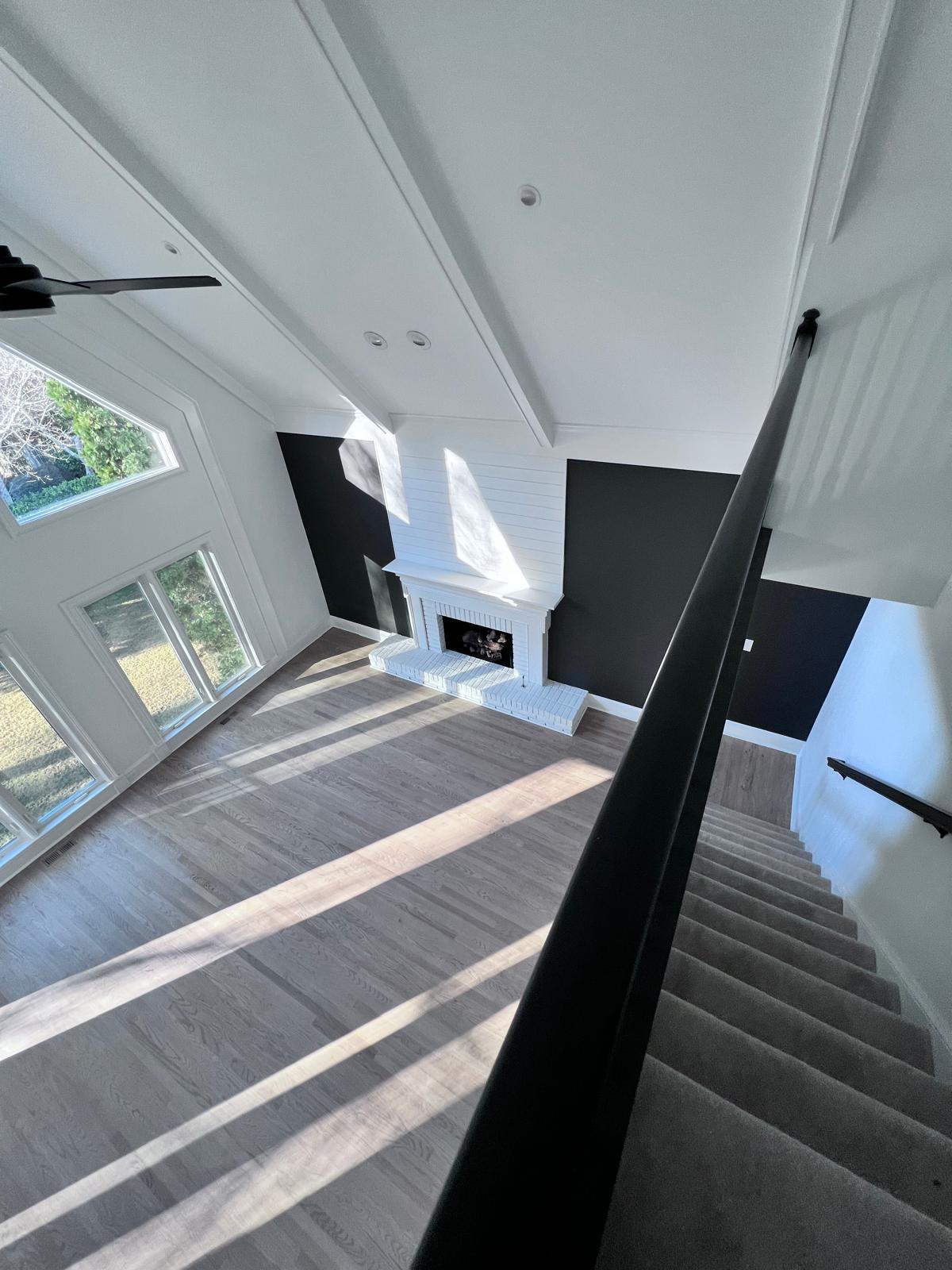 Black accent wall with fireplace
