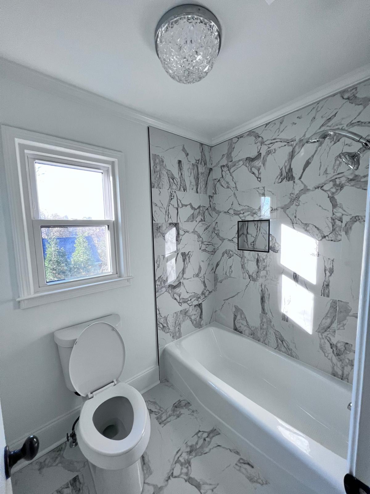 Full marble tile bathroom